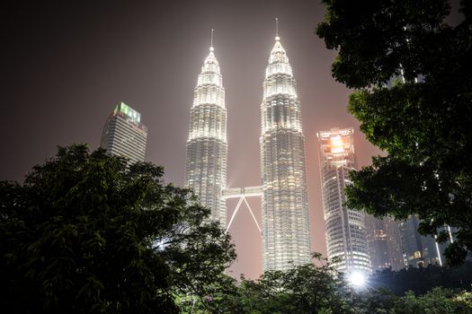 Kuala Lumpur, Malaysia - September 12 2019: The Kuala Lumpur skyline at KLCC featuring the Petronas Twin Towers and water show in Malaysia