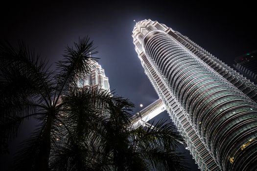 Kuala Lumpur, Malaysia - September 12 2019: The Kuala Lumpur skyline at KLCC featuring the Petronas Twin Towers and water show in Malaysia