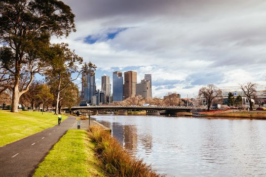 Melbourne, Australia - August 15, 2018: The Melbourne skyline from along the Yarra River near Morell Bridge on a cool winter's morning
