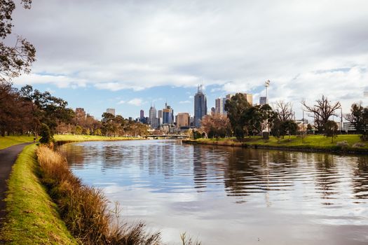 Melbourne, Australia - August 15, 2018: The Melbourne skyline from along the Yarra River near Morell Bridge on a cool winter's morning