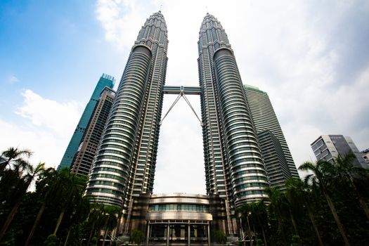Kuala Lumpur, Malaysia - March 19 2019: The Kuala Lumpur skyline featuring KLCC Park and Petronas Twin Towers in Malaysia