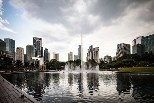 Kuala Lumpur, Malaysia - March 19 2019: The Kuala Lumpur skyline featuring KLCC Park in Malaysia