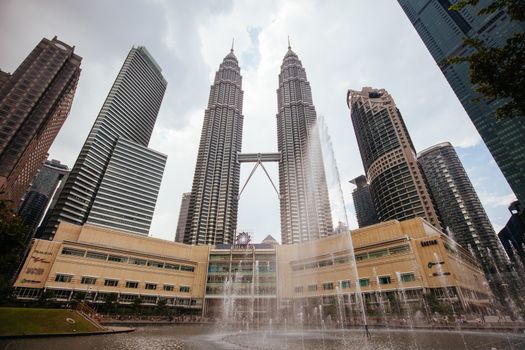 Kuala Lumpur, Malaysia - March 19 2019: The Kuala Lumpur skyline featuring KLCC Park in Malaysia