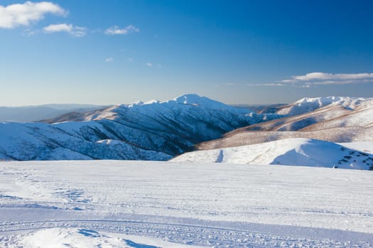 Mt Feathertop and surrounding landscape at sunset during winter near Mt Hotham in Victoria, Australia