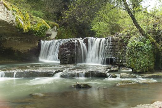 waterfall of fosso castello in soriano nel cimino viterbo in the wood