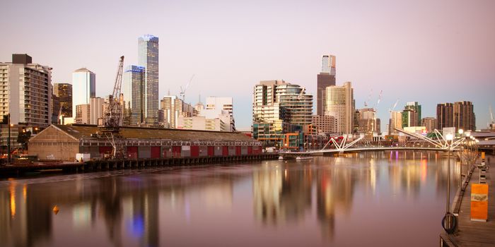 Melbourne skyline from South Wharf up the Yarra River at dusk in Melbourne, Victoria, Australia
