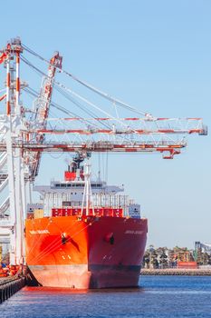 Melbourne, Australia - 17 December 2013: Coode Island shipping port with boats being unloaded in Melbourne, Victoria, Australia