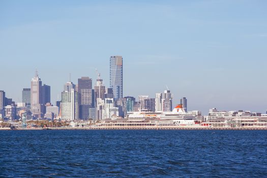 Melbourne skyline with Station Pier and the Spirit of Tasmania boat in dock on a summer's day from Port Phillip Bay
