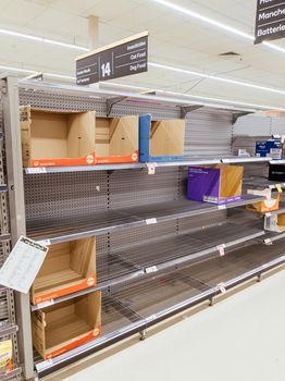 Melbourne, Australia - March 4th 2020: Panicked shoppers buy staples such as canned food, rice, milk and toilet paper. They live in fear of Corona Virus shortening stock supply from China.