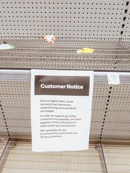 Melbourne, Australia - March 4th 2020: Panicked shoppers buy staples such as canned food, rice, milk and toilet paper. They live in fear of Corona Virus shortening stock supply from China.