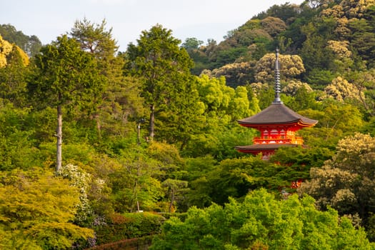 The iconic Kiyomizu-dera temple and mountain view on a sunny spring day in Kyoto, Japan