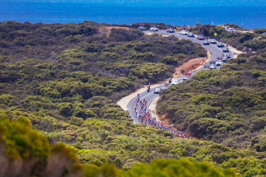 GEELONG, AUSTRALIA - FEBRUARY 2, 2020: The peloton rounds Bells Beach during the 2020 Cadel Evans Great Ocean Road Race