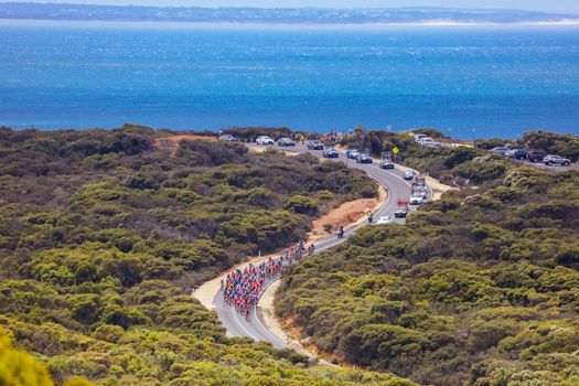 GEELONG, AUSTRALIA - FEBRUARY 2, 2020: The peloton rounds Bells Beach during the 2020 Cadel Evans Great Ocean Road Race