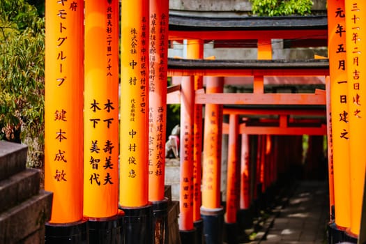 Red Tori Gate at Fushimi Inari Shrine in Kyoto, Japan. One of the largest tourist attractions in Japan