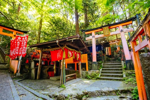 Red Tori Gate at Fushimi Inari Shrine in Kyoto, Japan. One of the largest tourist attractions in Japan