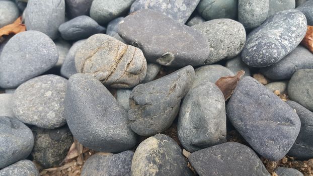 Rock Pebbles, small, rounded, smooth rocks. Texture background for text.