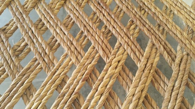 Closeup view of dried jute thread or ropes interwoven for making traditional old style bed called charpai