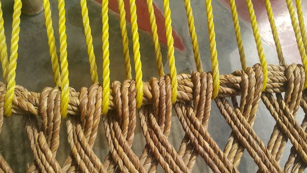 Closeup view of dried jute thread or ropes interwoven for making traditional old style bed called charpai