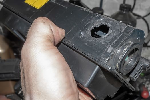 a hole from poor quality disassembly of the cartridge case from the printer for refilling toner in the hands of an inexperienced service center master