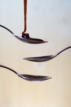 Honey in a spoon.White background