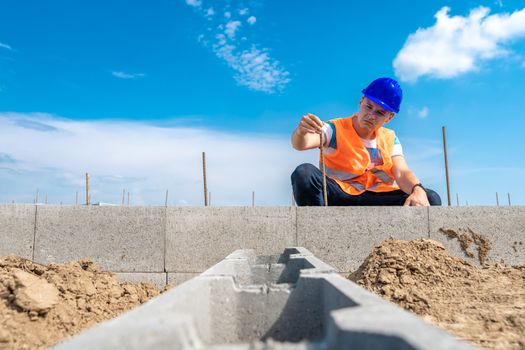 craftsman on the construction of the foundation of the building. copy space