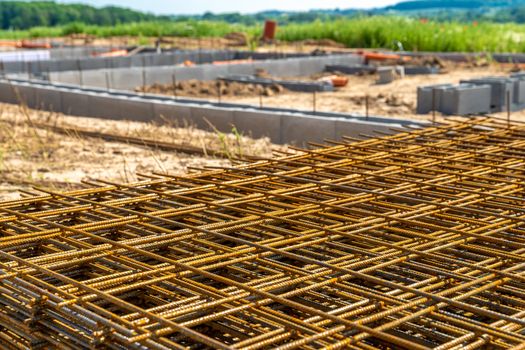 iron lattice for the foundation of a family house.