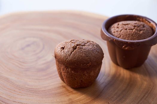 Homemade chocolate cupcakes on a wooden table. High quality photo