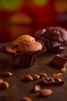 Chocolate maffin on a wooden table with chocolate and tartallini . High quality photo