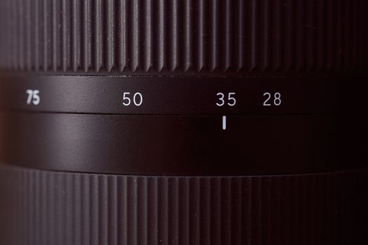 view of the focal length ring Photo lens 28-75 mm. Close-up. Very high quality photo.. High quality photo