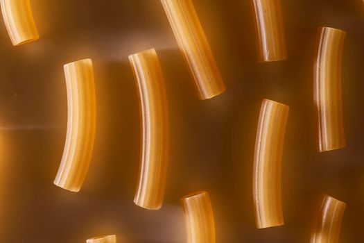 Wheat pasta lies on a white background. High quality photo