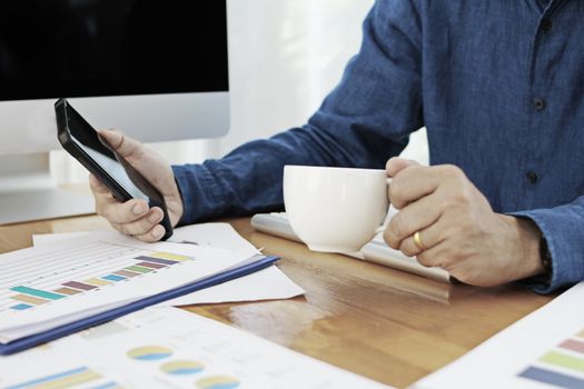 Business men have a cup of coffee Sit and work on the table