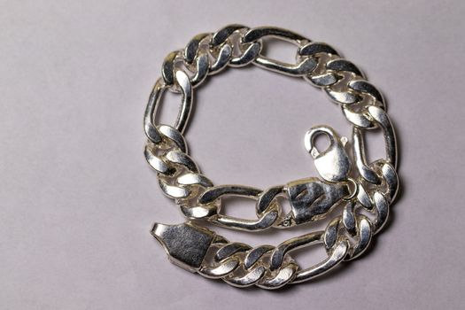 silver bracelet chain on white background