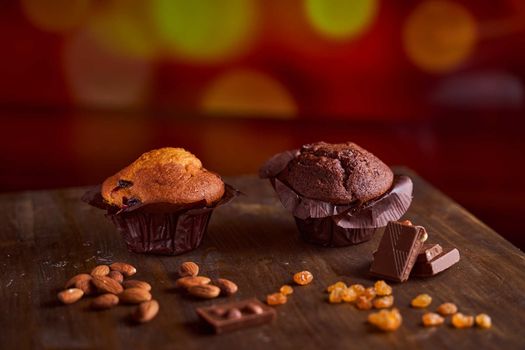 Chocolate maffin on a wooden table with chocolate and tartallini . High quality photo