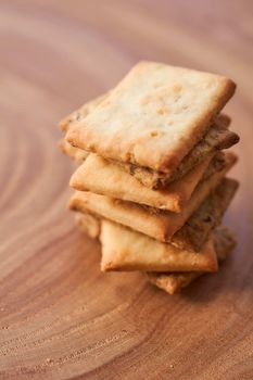 Wheat dry biscuits with spices on a wooden table . High quality photo