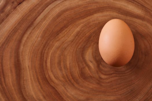 chicken eggs on a wooden background. Concept photo. Close-up. High quality photo