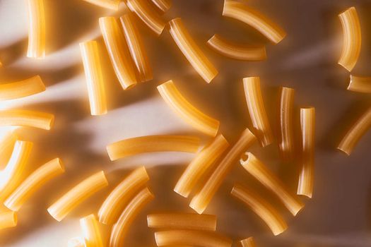 Wheat pasta lies on a white background. High quality photo