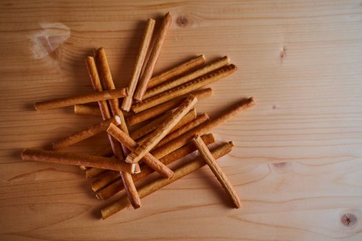 Bread sweet sticks on a wooden light board. High quality photo