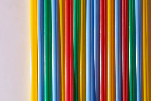 Abstract Background Multicolored Plastic Drinks Tubes. Close-up. High quality photo