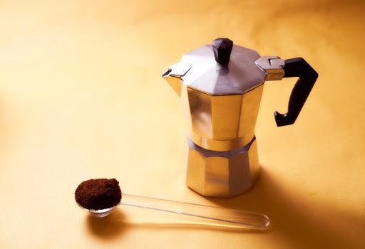  geyser coffee maker with fresh coffee on a yellow background. High quality photo