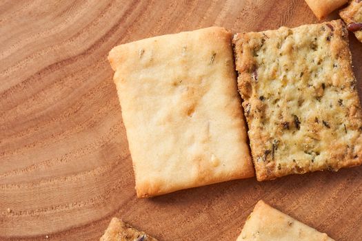 Wheat dry biscuits with spices on a wooden table . High quality photo