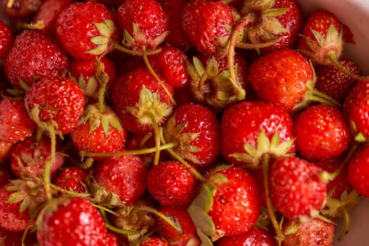 Dacha ripe strawberries. Close-up. Top view. Macro effect photo. High quality photo