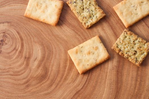 Wheat dry biscuits with spices on a wooden table . High quality photo