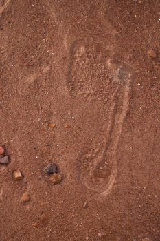 trace of the human foot on the sand. High quality photo