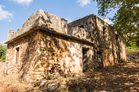 ruined house facing the mountains on the island of Crete in Greece