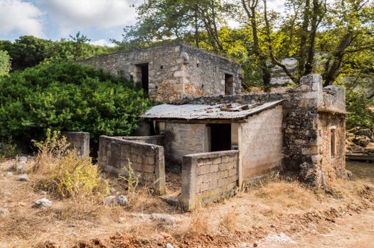 ruined house facing the mountains on the island of Crete in Greece