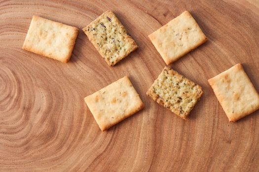 Wheat dry biscuits with spices on a wooden table . High quality photo