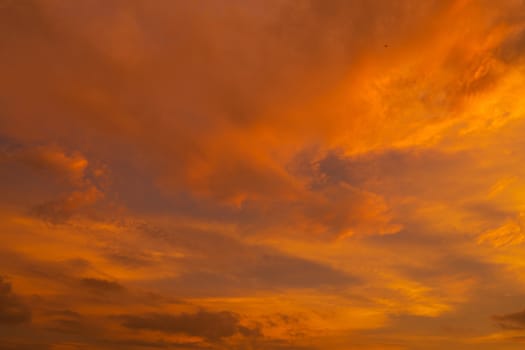 unusually beautiful fiery red tropical sunset. Burning clouds. Fire in the sky.