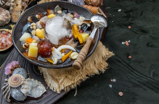 Sweet dessert : kind of Chinese dessert with boil sugar syrup is delicious here are many grains, including green beans, lotus seeds, millet, persimmon, jelly, longan, boiled flour and sugar add more cool feeling with ice. Copy space, Selective focus.