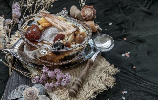 Sweet dessert : kind of Chinese dessert with boil sugar syrup is delicious here are many grains, including green beans, lotus seeds, millet, persimmon, jelly, longan, boiled flour and sugar add more cool feeling with ice. Copy space, Selective focus.