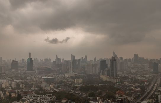 Bangkok, Thailand - 13 Apr, 2019 : Dark clouds before a rain are falling in the city. A large rainstorm makes traveling in Bangkok difficult. Black clouds are brewing in Bangkok. focus and blur.